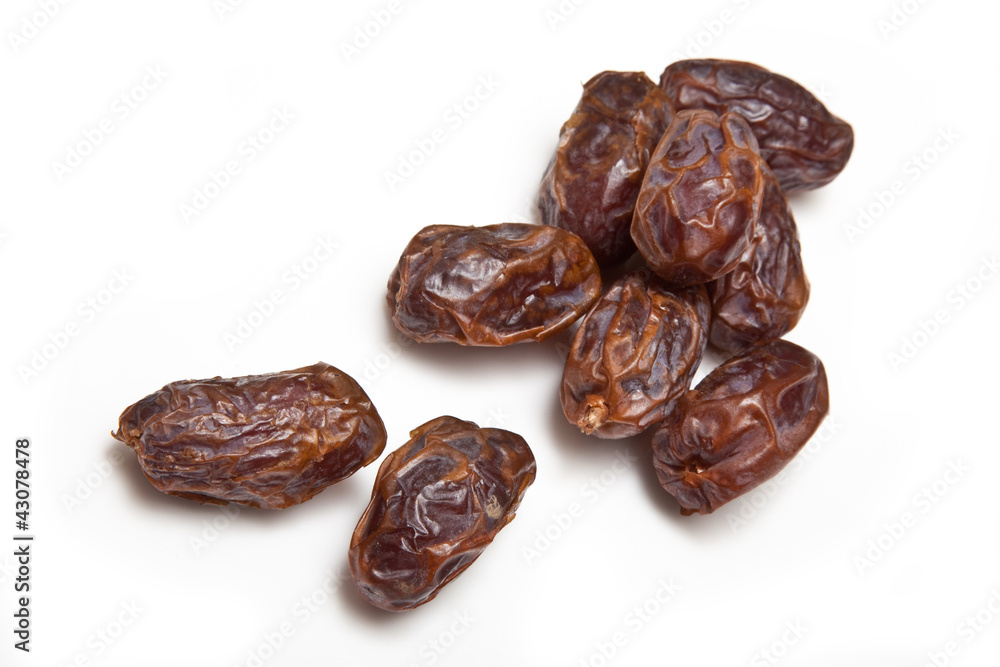 Medjool dates isolated on a white studio background. Medjool dates isolated on a white studio background.