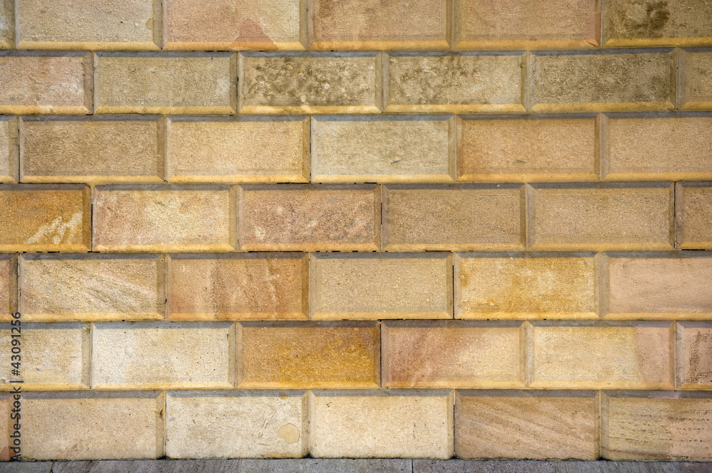 Fototapeta premium carved bricks in a wall full frame