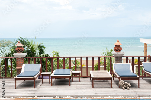 Thai style  swimming pool with villa against sea