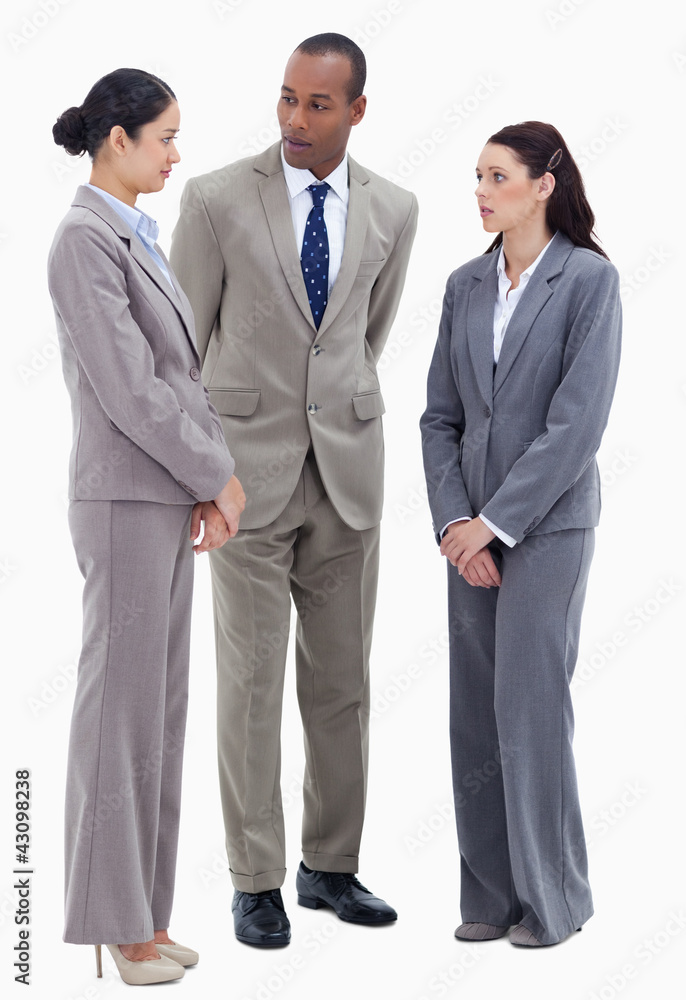 Two business people watching their co-worker Two business people watching their co-worker