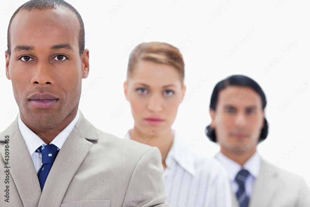 Big close-up of serious people dressed in suits in a single line Big close-up of serious people dressed in suits in a single line