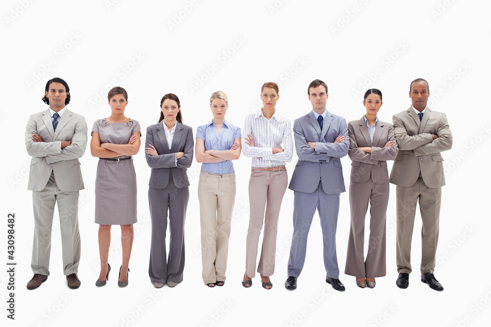 Serious business team side by side crossing their arms Serious business team side by side crossing their arms