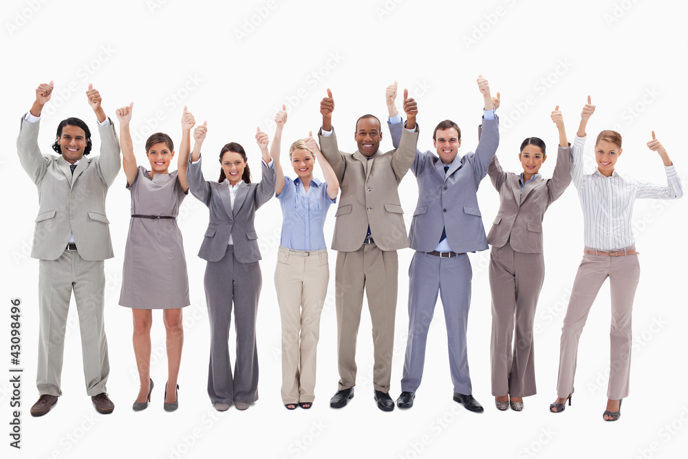 Business team raising their arms with the thumbs up