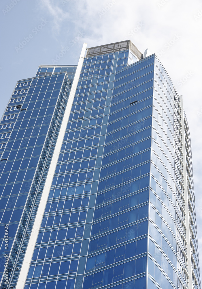 Blue Glss Office Tower Rising Toward Sun