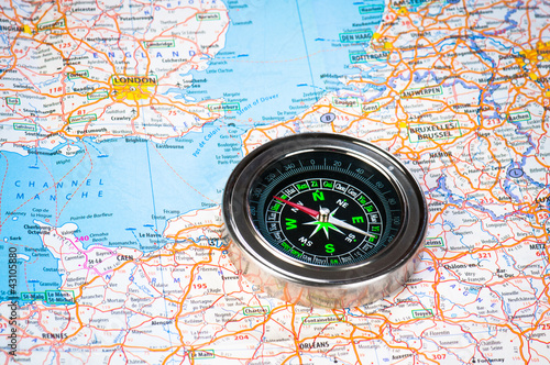 A compass on the map of the European continent.