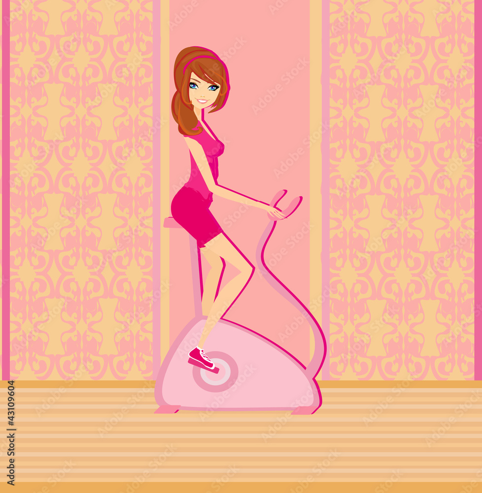 Girl on the exercise bike Girl on the exercise bike