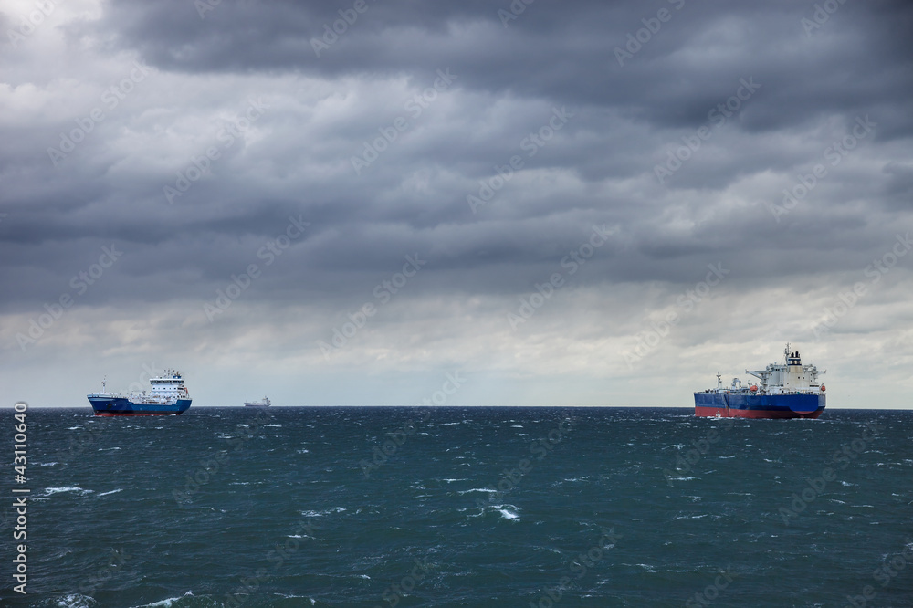 Two ships at sea and the upcoming storm.