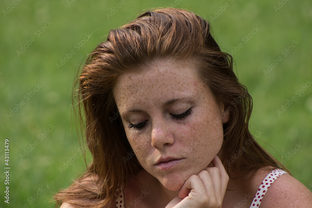 Beautiful red hair girl in a campus