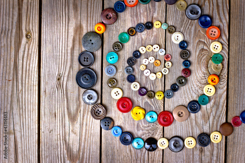 Set of vintage buttons on old wooden table