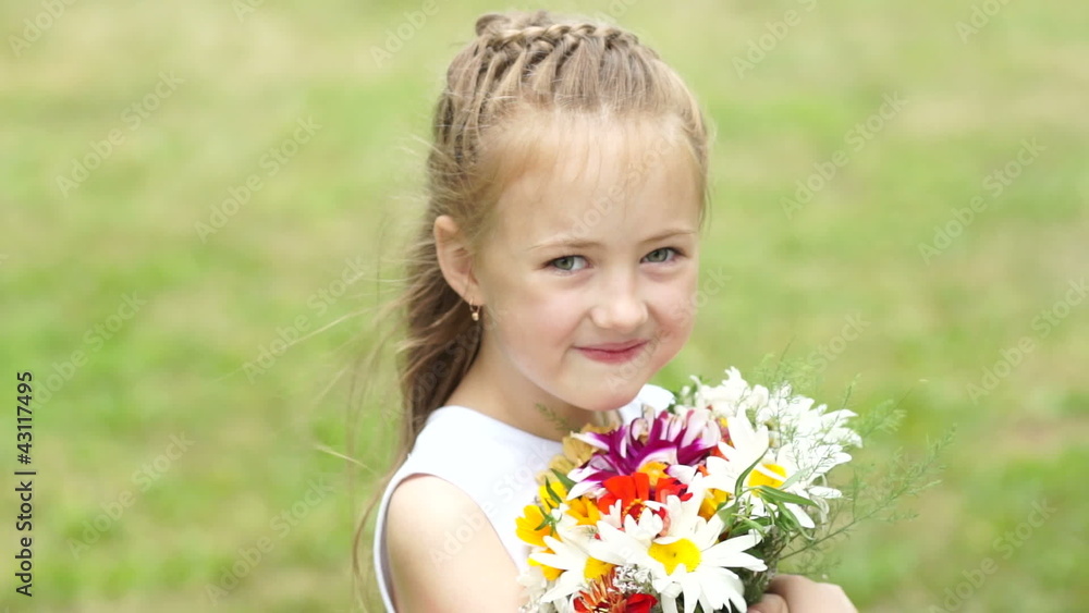 Portrait smiling girl with bouquet of flowers Portrait smiling girl with bouquet of flowers