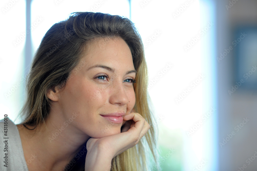 Portrait of beautiful blond woman relaxing in sofa Portrait of beautiful blond woman relaxing in sofa