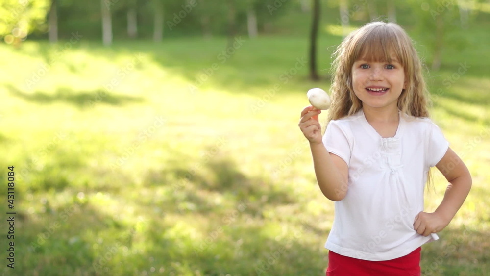 Happy child holding a mushroom Happy child holding a mushroom