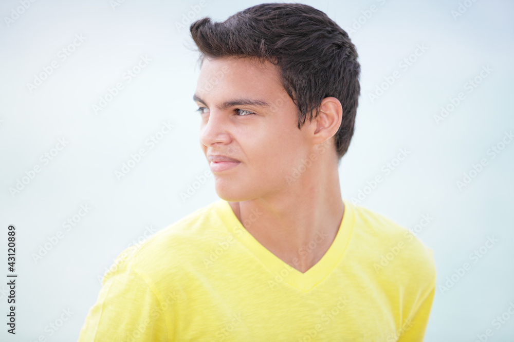 Stock image of a teenager looking over shoulder Stock image of a teenager looking over shoulder
