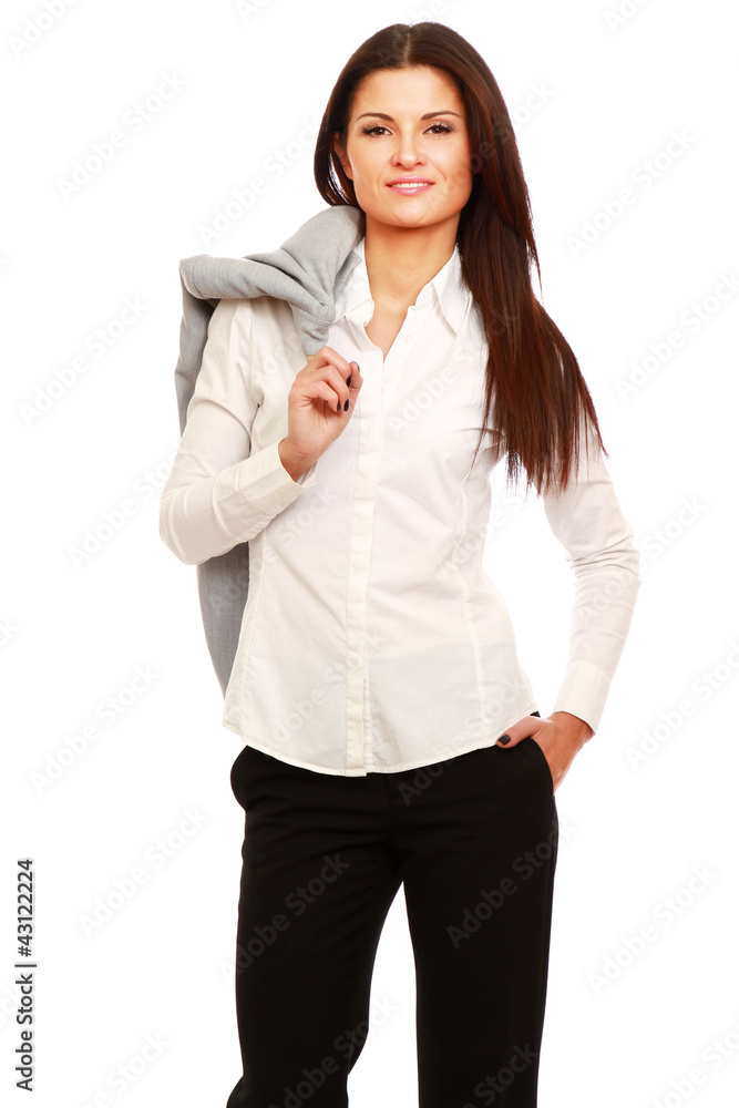 A businesswoman standing with a jacket on her shoulder A businesswoman standing with a jacket on her shoulder