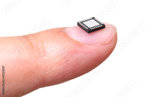 Computer microchip on girls fingernail