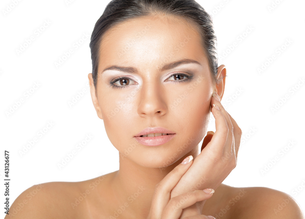 A young woman touching her face , isolated on white background A young woman touching her face , isolated on white background