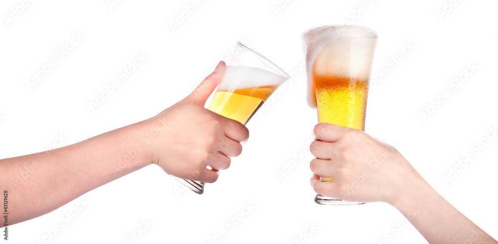 Pair of beer glasses with hand making a toast isolated Pair of beer glasses with hand making a toast isolated