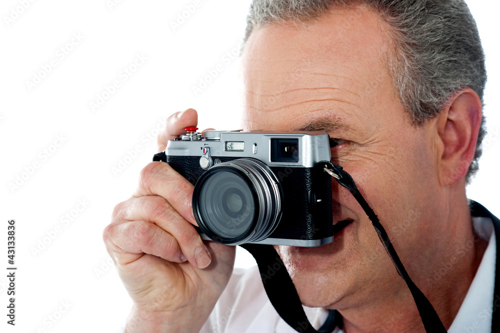 Closeup view of a male photographer taking photo