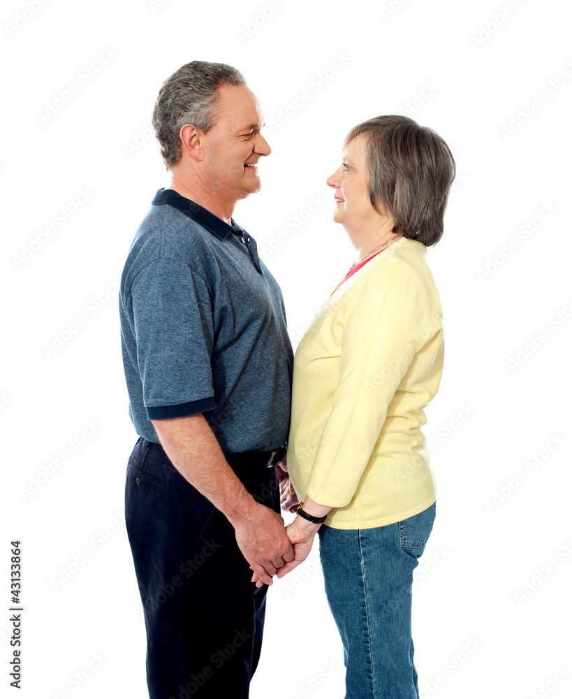 Aged couple in love holding hands Aged couple in love holding hands