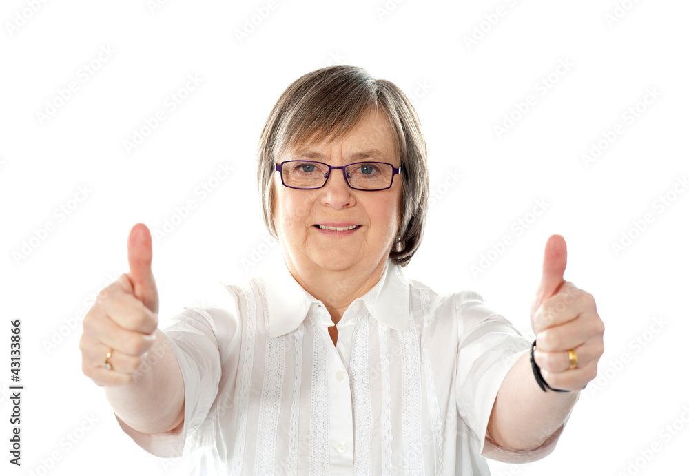 Female gesturing double thumbs up