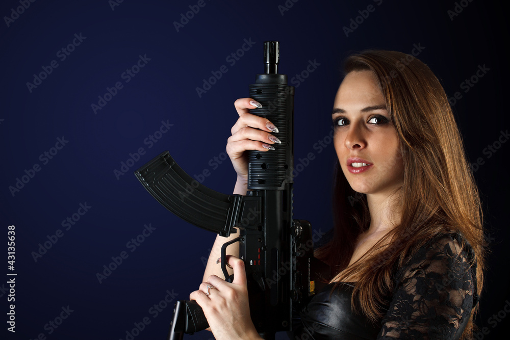 Woman posing with gun Woman posing with gun