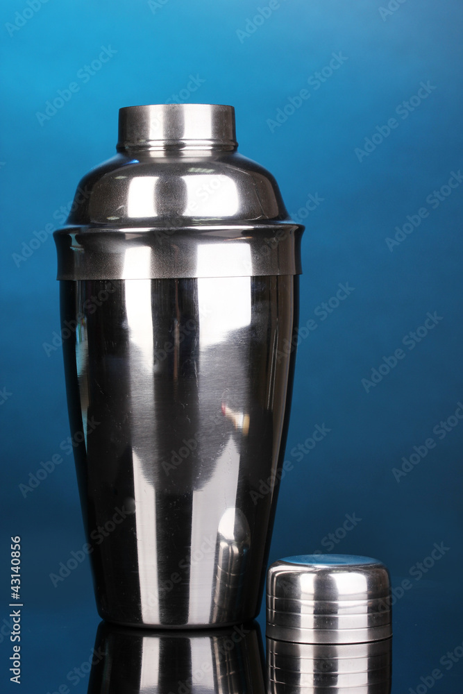 Cocktail shaker on blue background Cocktail shaker on blue background