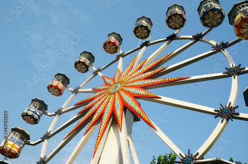 Ferris wheel against blue sky