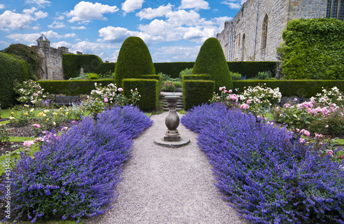 beds of lavender leading to sundial and formal hedges