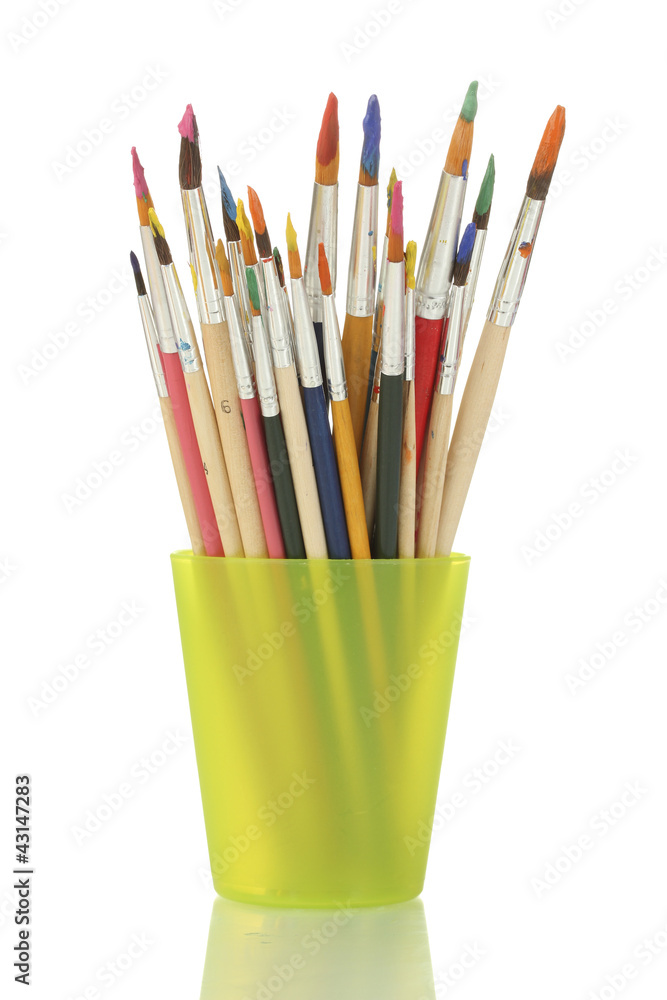 Paint brushes with gouache in cup isolated on white Paint brushes with gouache in cup isolated on white