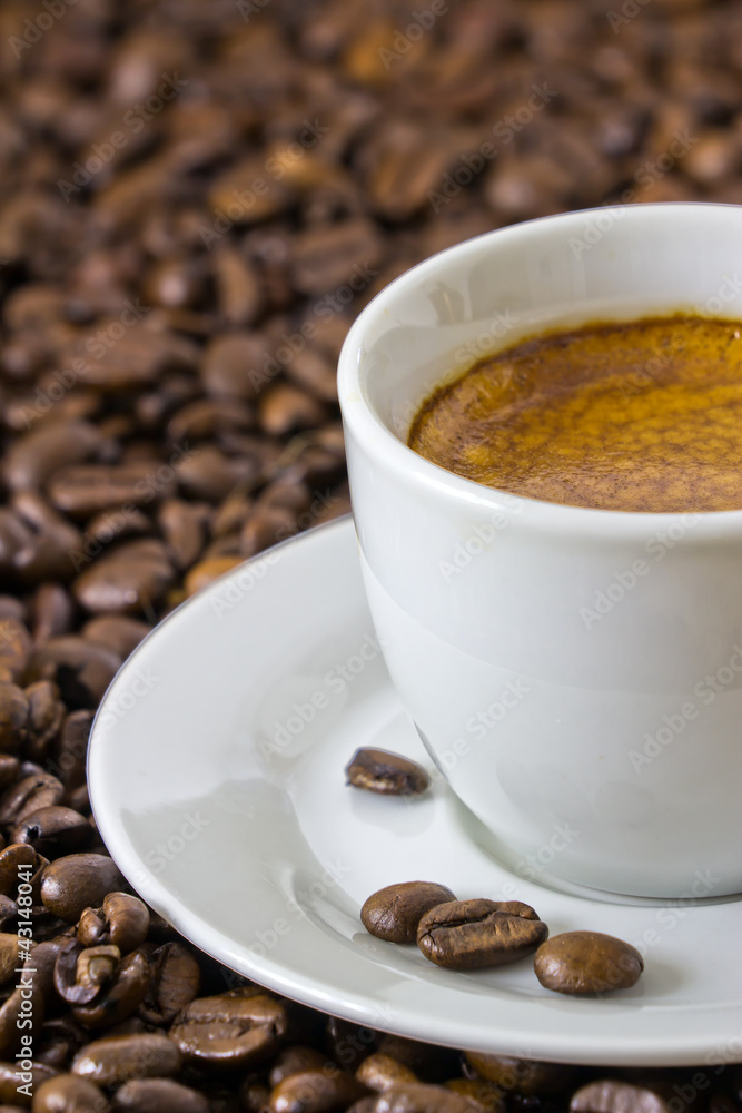 detail of a fresh espresso at roasted coffee beans detail of a fresh espresso at roasted coffee beans