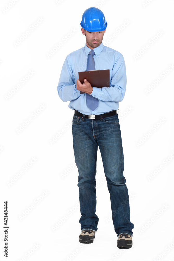 Building planner holding clip-board Building planner holding clip-board