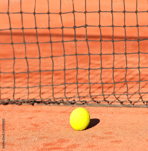 tennis ball close to net on clay court © lusia83