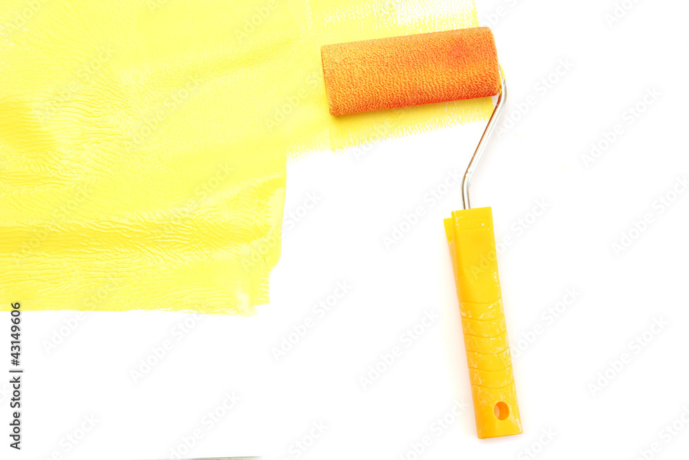 Obraz premium Paint roller with yellow paint isolated on white