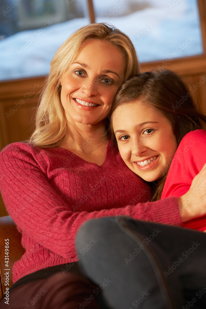 Portrait Of Mother And Daughter Relaxing On Sofa Together Portrait Of Mother And Daughter Relaxing On Sofa Together