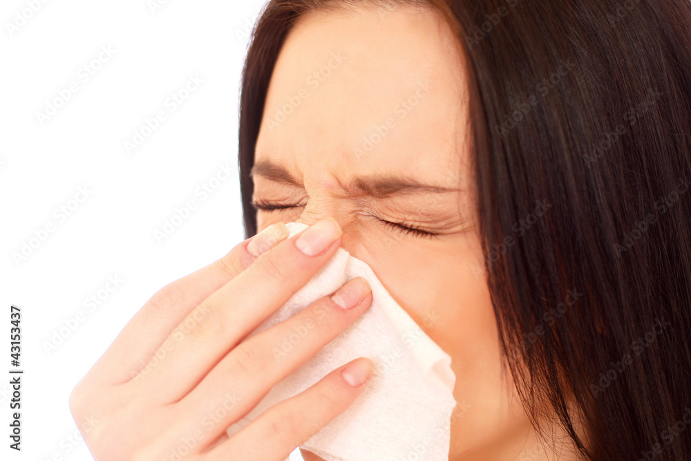 A sneezing woman A sneezing woman