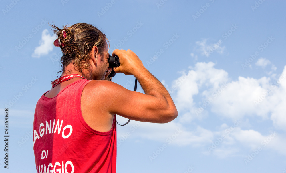 Fototapeta premium Lifeguard with binoculars