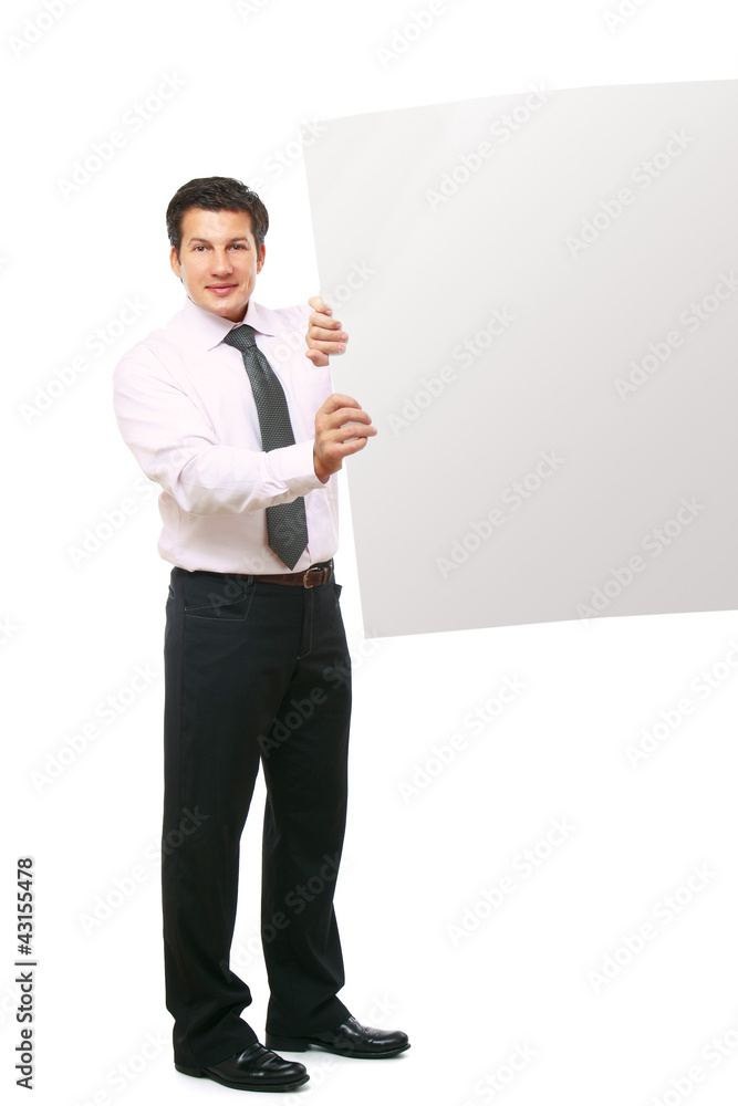 Businessman holding a blank, isolated on white background
