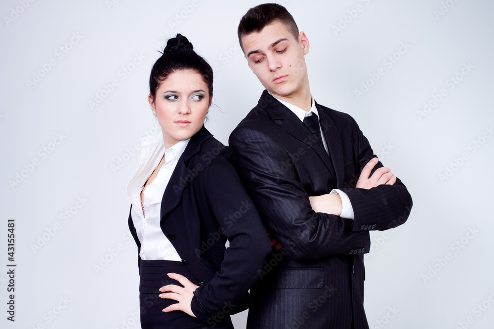 modern young business couple posing on gray background modern young business couple posing on gray background