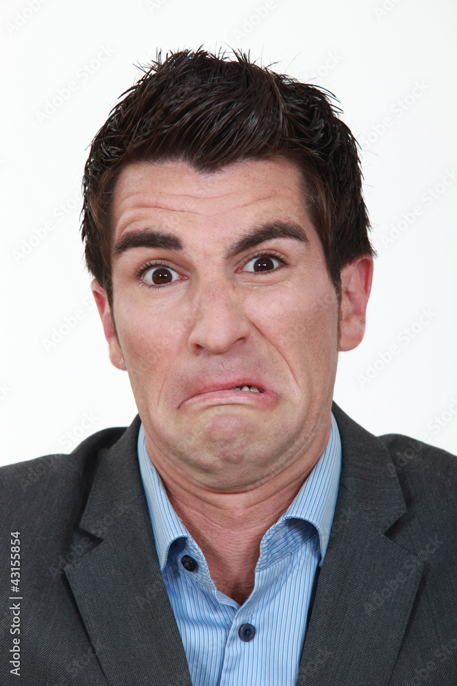 Portrait of a man grimacing Portrait of a man grimacing