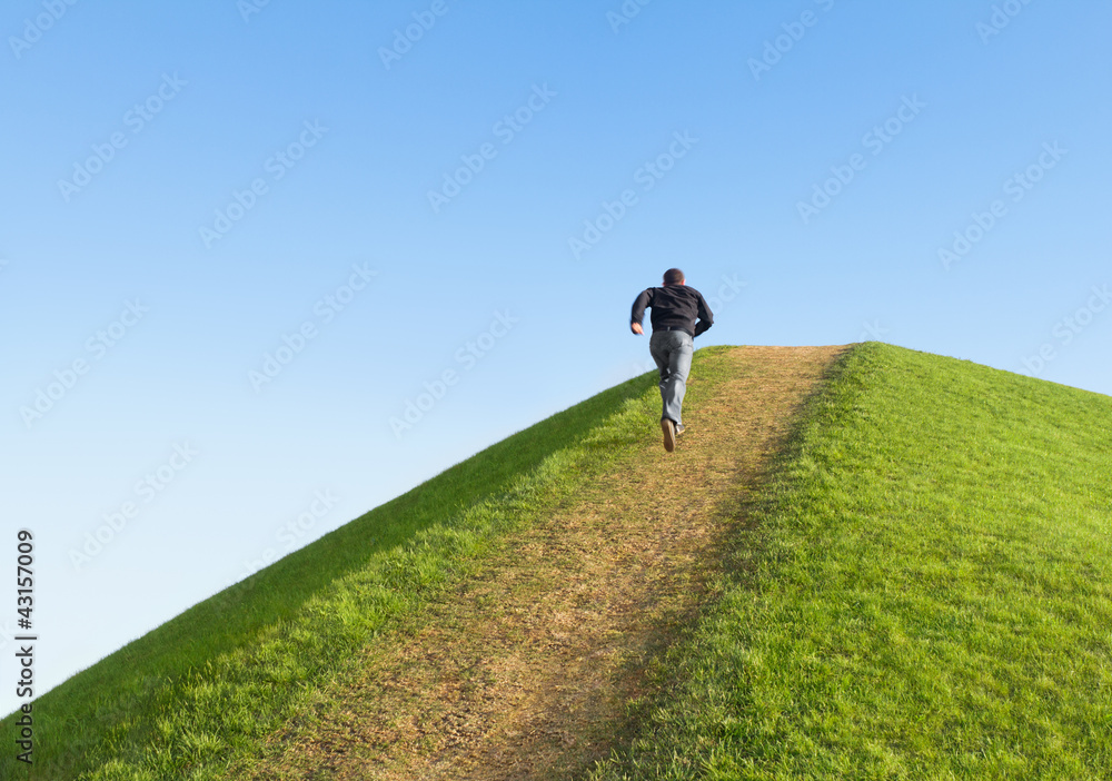Pathway up the hill against the sky. Man ran to the top. - obrazy, fototapety, plakaty 