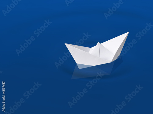 Paper boat on the water