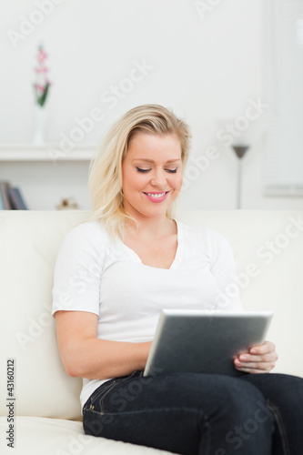 Casual woman touching a screen of an ebook