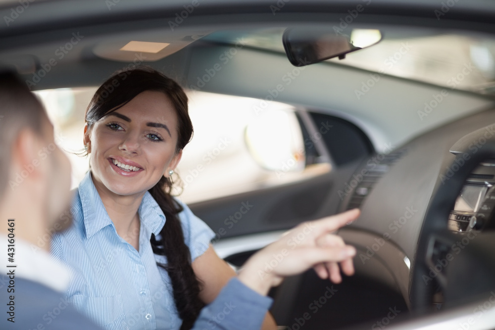 Man pointing a car interior Man pointing a car interior