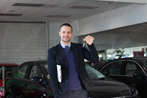 Wallpaper Mural Salesman holding car keys Torontodigital.ca