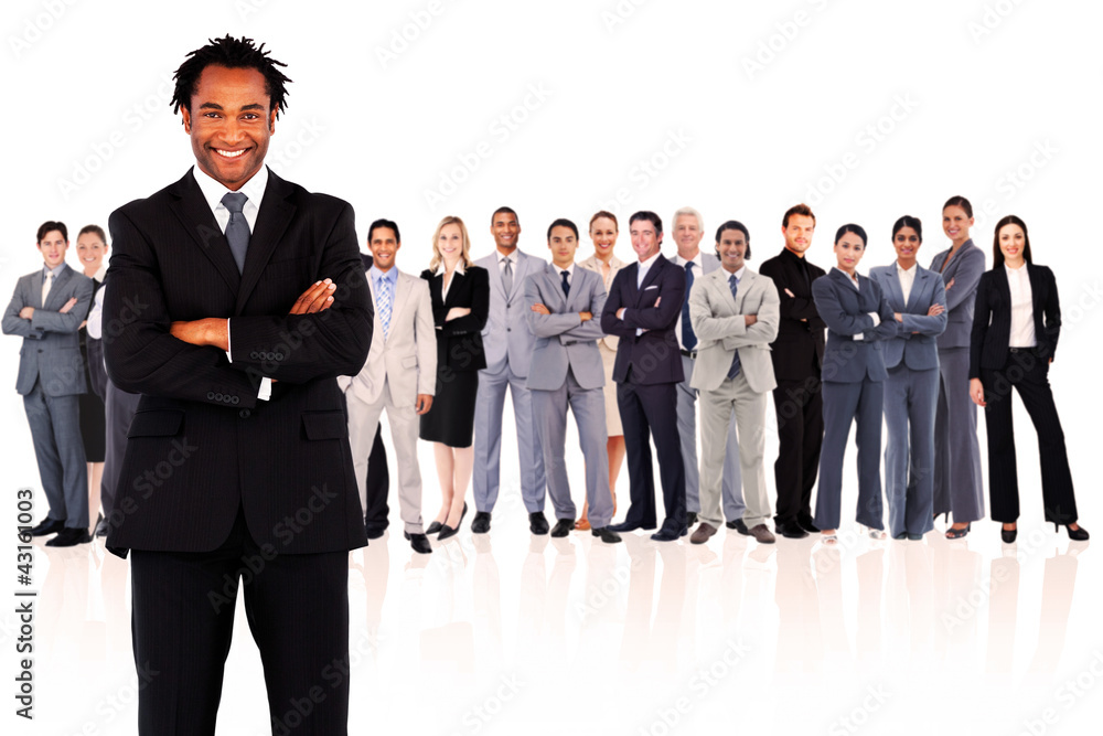 Businessman standing while smiling Businessman standing while smiling