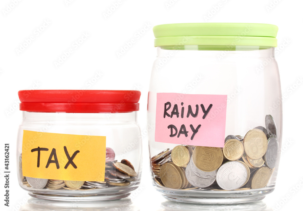 Glass banks for tips with money isolated on white Glass banks for tips with money isolated on white