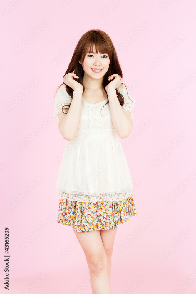 Beautiful young woman on pink background. Portrait of asian. Beautiful young woman on pink background. Portrait of asian.
