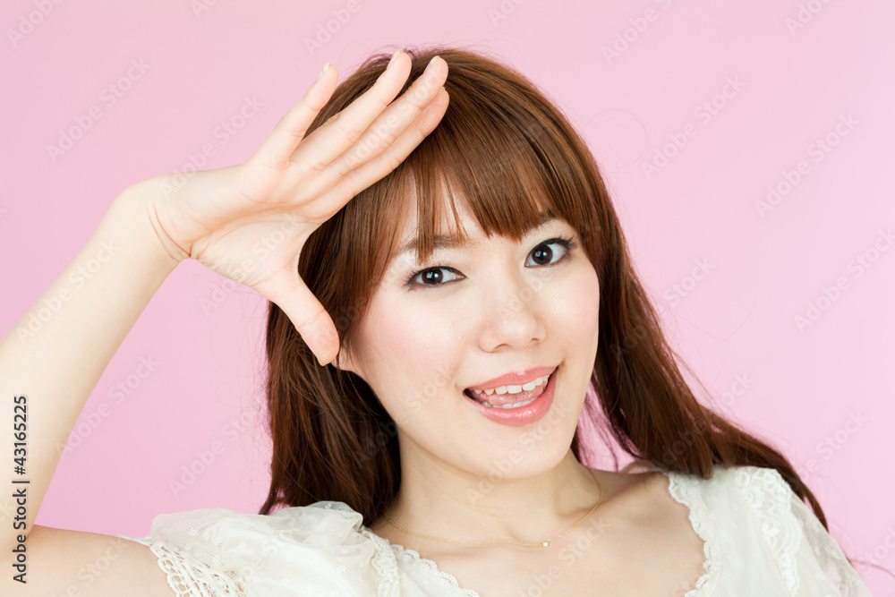 Beautiful young woman on pink background. Portrait of asian. Beautiful young woman on pink background. Portrait of asian.