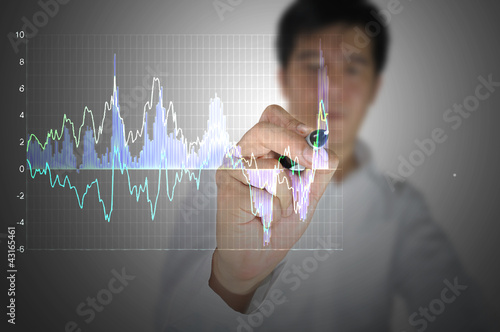 Business Man write graph
