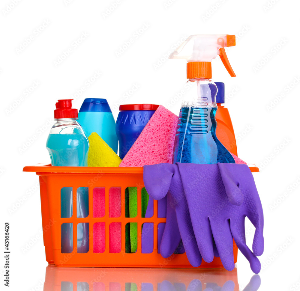 Cleaning items in plastic basket isolated on white Cleaning items in plastic basket isolated on white